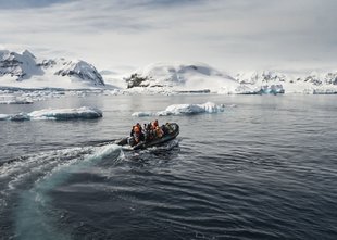 Zodiac Crusing through icebergs Antarctica