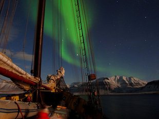 At anchor amongst islands beneath the Northern Lights