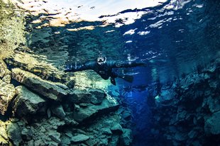 snorkeler-floating-in-big-crack-by-anders-nyberg-1800x1199.jpg