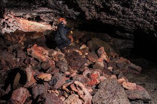 caver-on-rock-pile-leidarendi-by-anders-nyberg-iceland.jpg