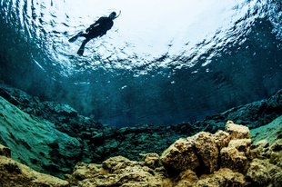 single-snorkeler-flying-over-lagoon-by-anders-nyberg-1800x1199.jpg