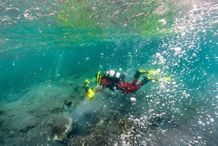 diver-geothermal-hot-spring-iceland-lake.jpg