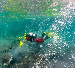 diver-geothermal-hot-spring-iceland-lake.jpg