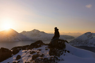 Absorbing the panorama after hiking to the top of a mountain in Northern Norway