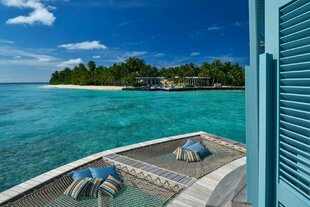 View from one island to another at an Overwater Villa Raffles Maldives Meradhoo Huvadhu