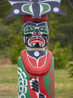 A colourful Kwakwaka'wakw Totem Pole in Alert Bay