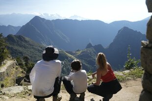 Travellers overlooking the views of Machu Picchu