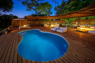 Cool down with a relaxing swim and enjoy stunning views of the Okavango Delta
