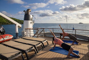 Outdoor yoga on M/Y Pegasos' sun deck