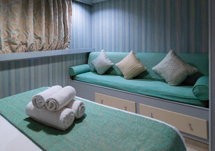 The sofa of a category P cabin on M/Y Pegasos